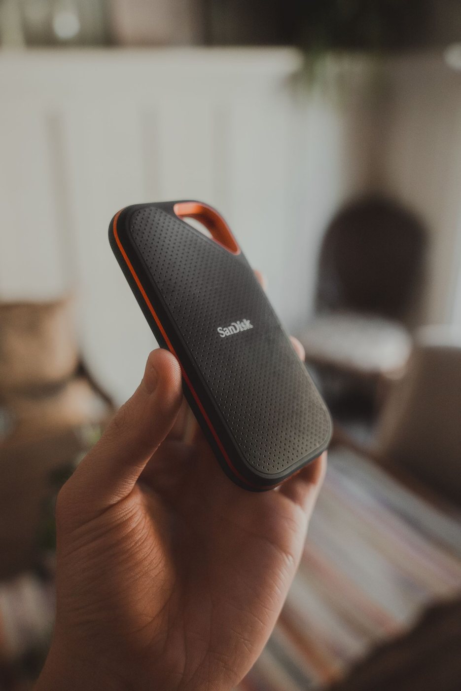 Portable storage drive shown in a hand