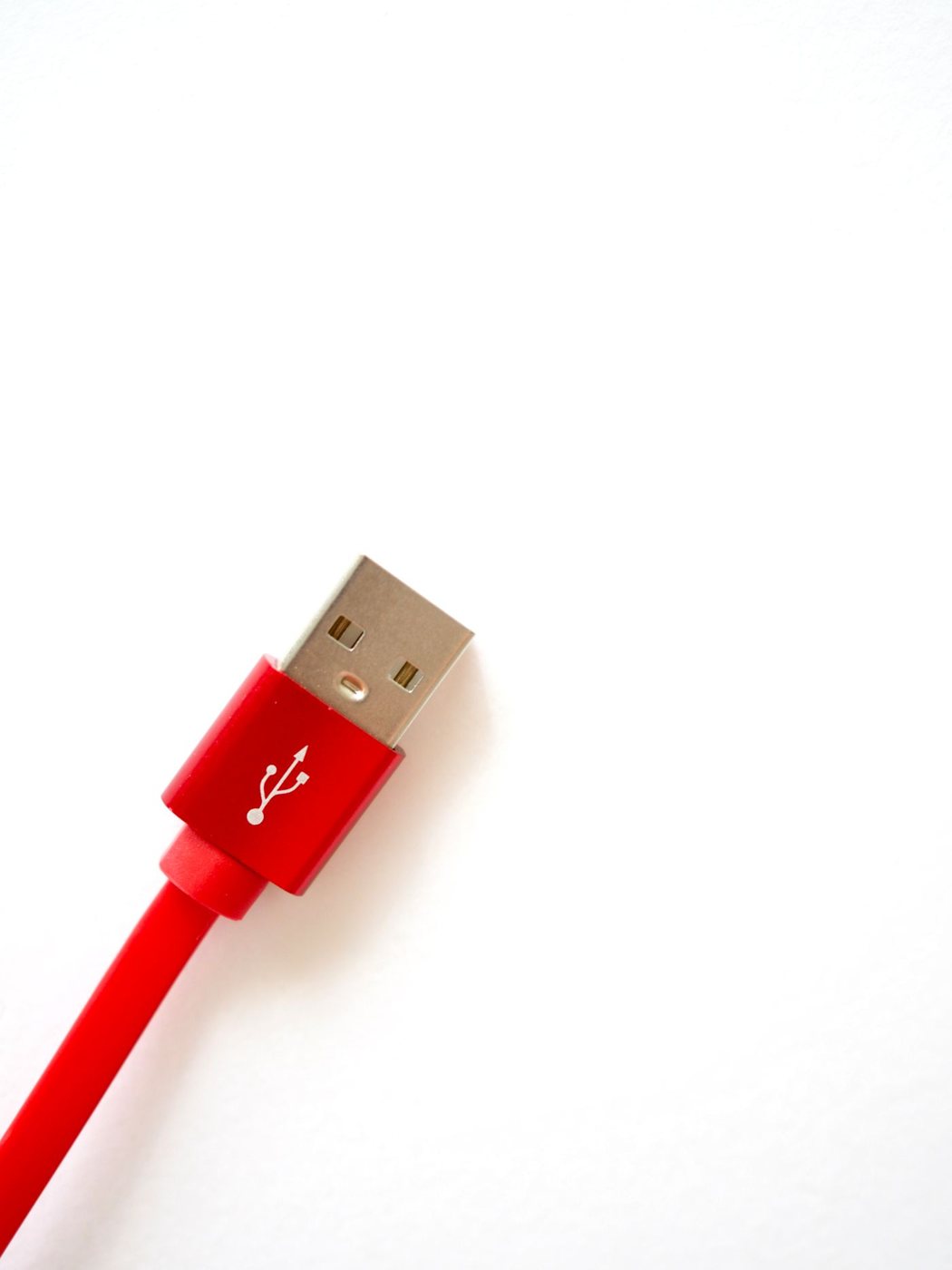 Red USB cable on a light background