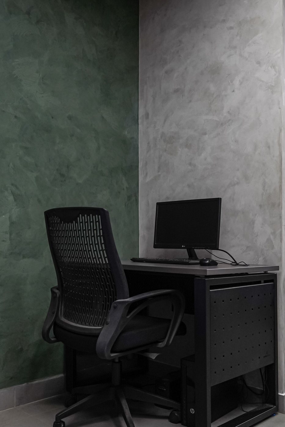Mesh office chair beside a desk
