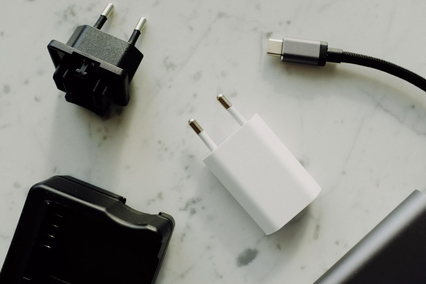 Power adapters and charging cable arranged together