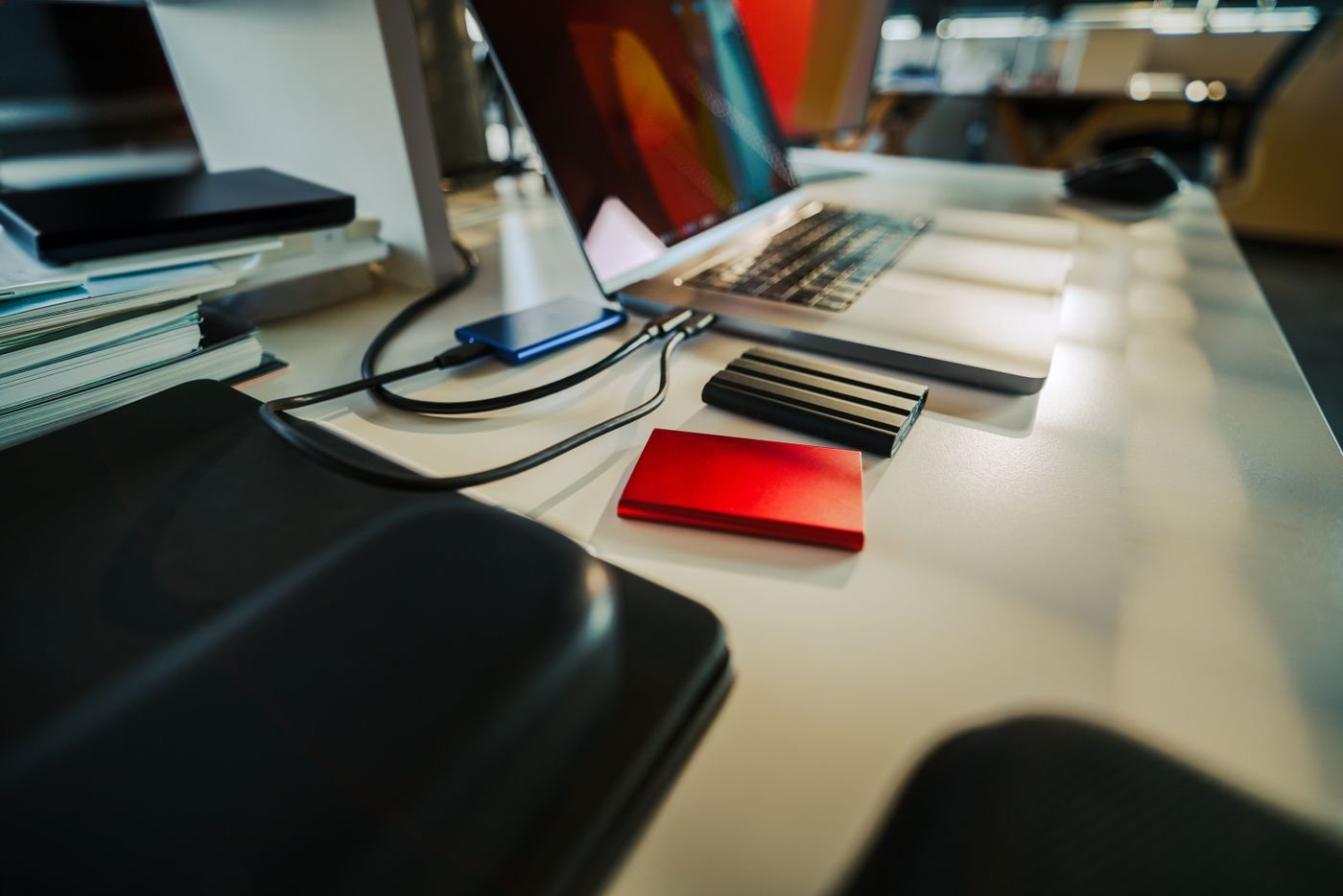 Laptop and external storage drives on a desk