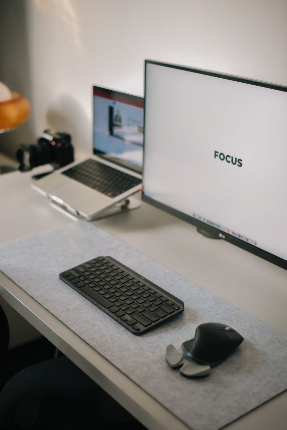 Organized desk with laptop and monitor