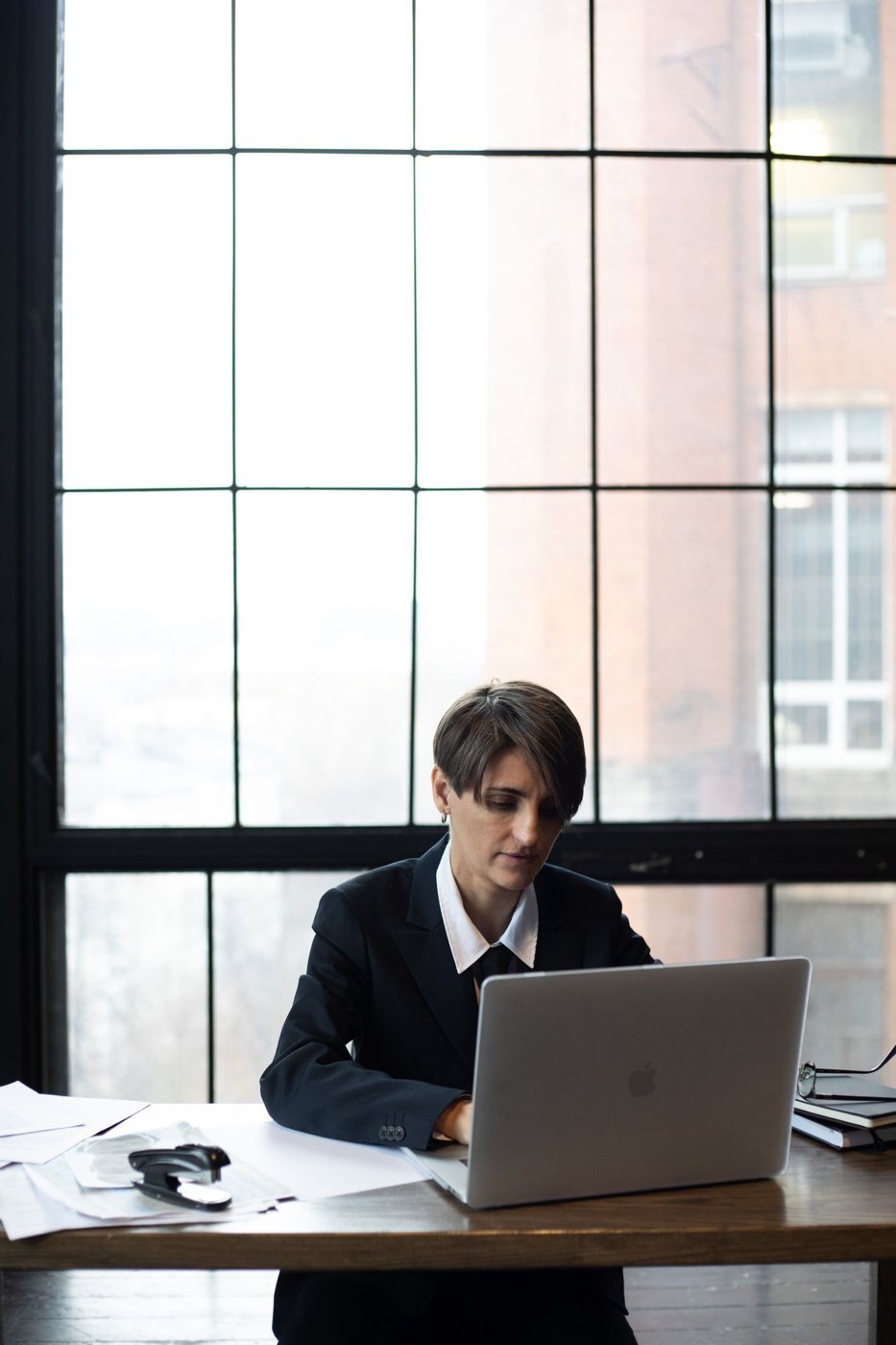Person focused on a laptop in a quiet workspace