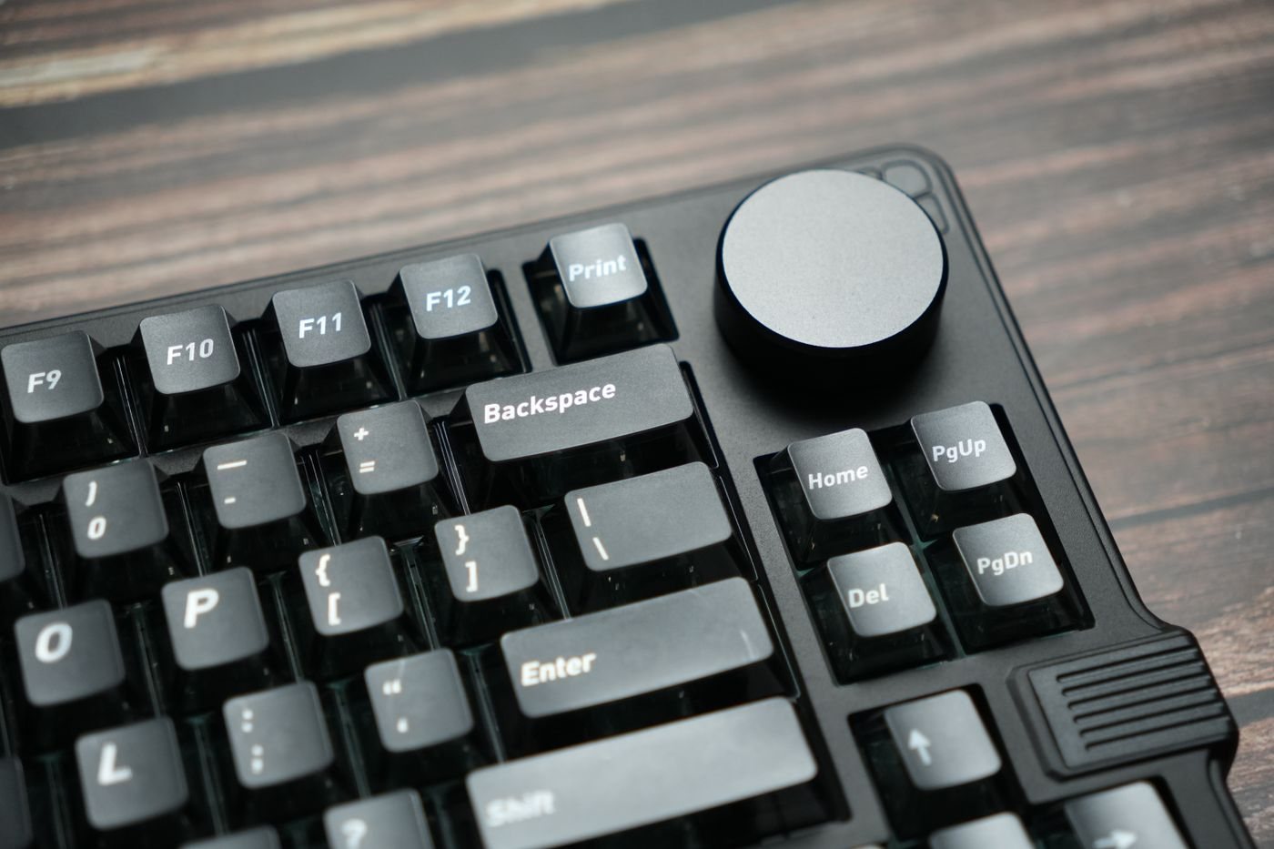 Close-up of mechanical keyboard keys and control knob