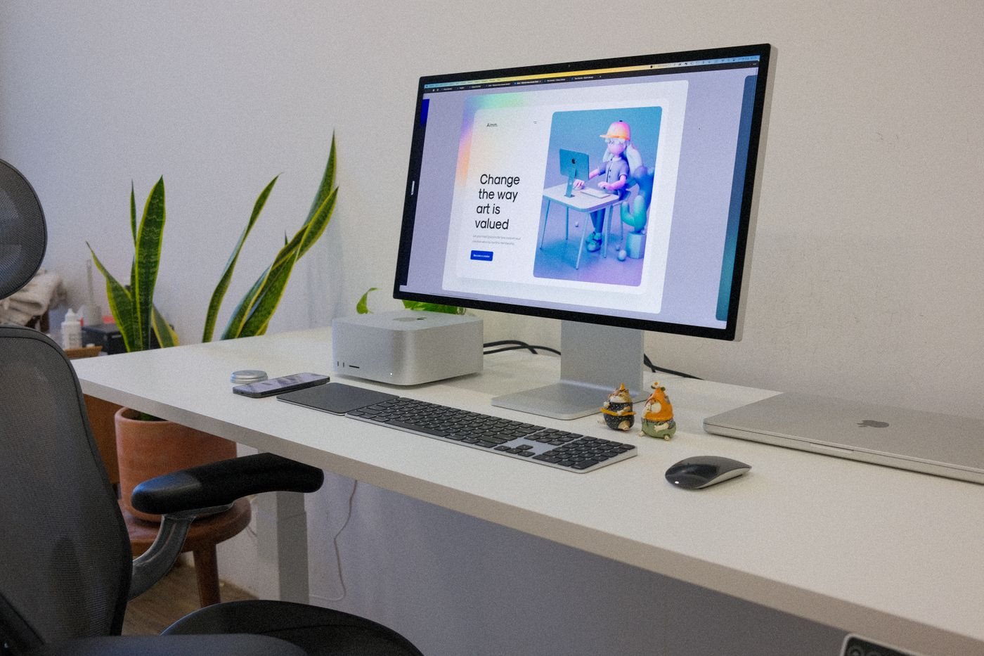 Desktop computer and laptop together in a workspace
