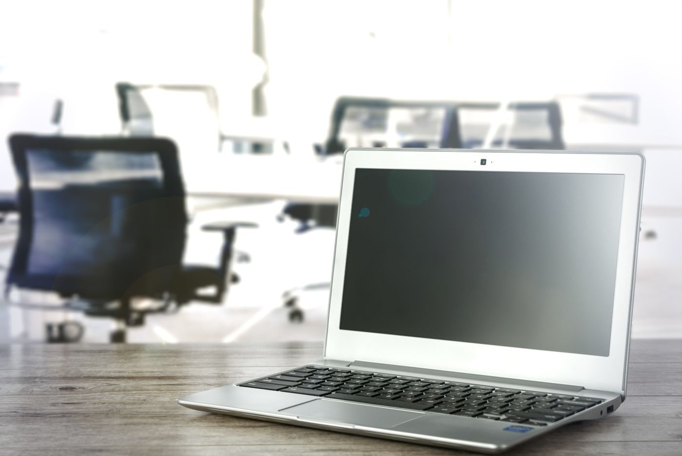 Laptop screen in a bright office