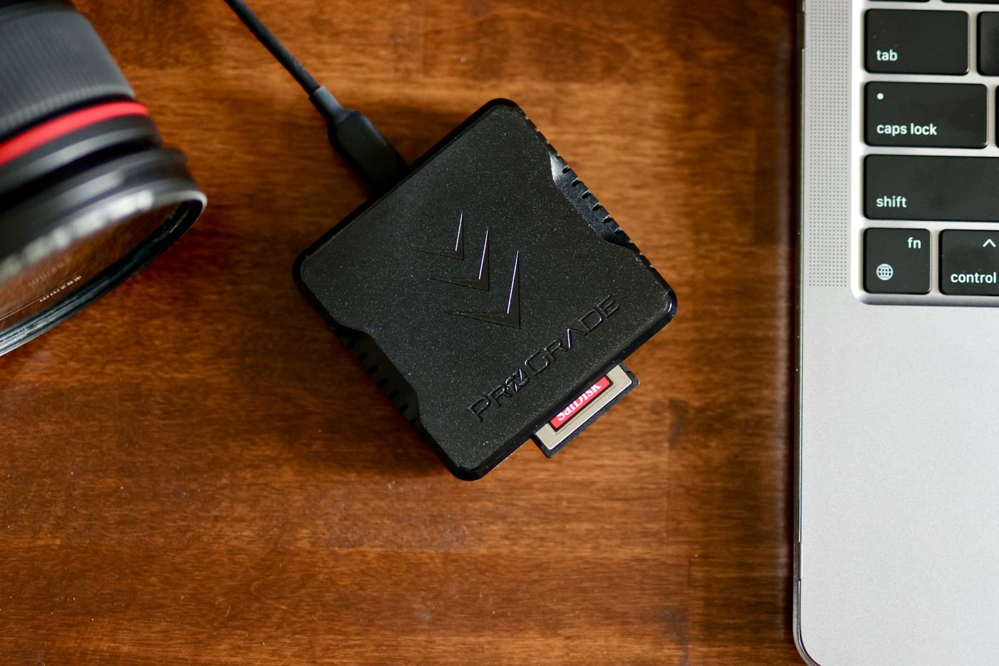Memory card and reader beside a laptop