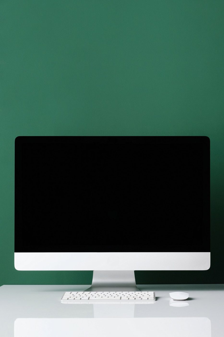 Desktop monitor and stand on a white table