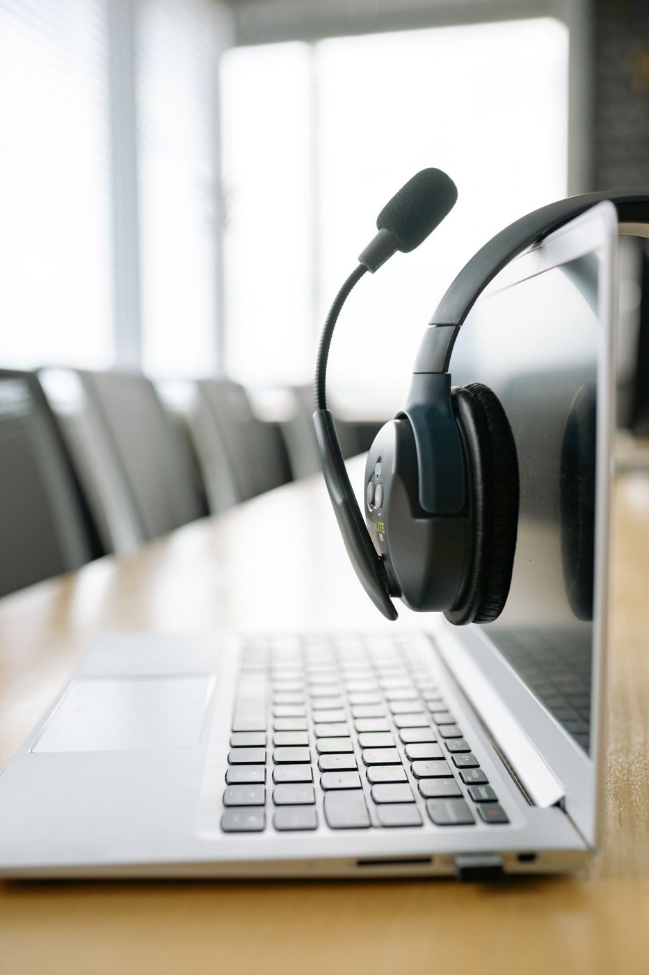 Headset beside a laptop in an office