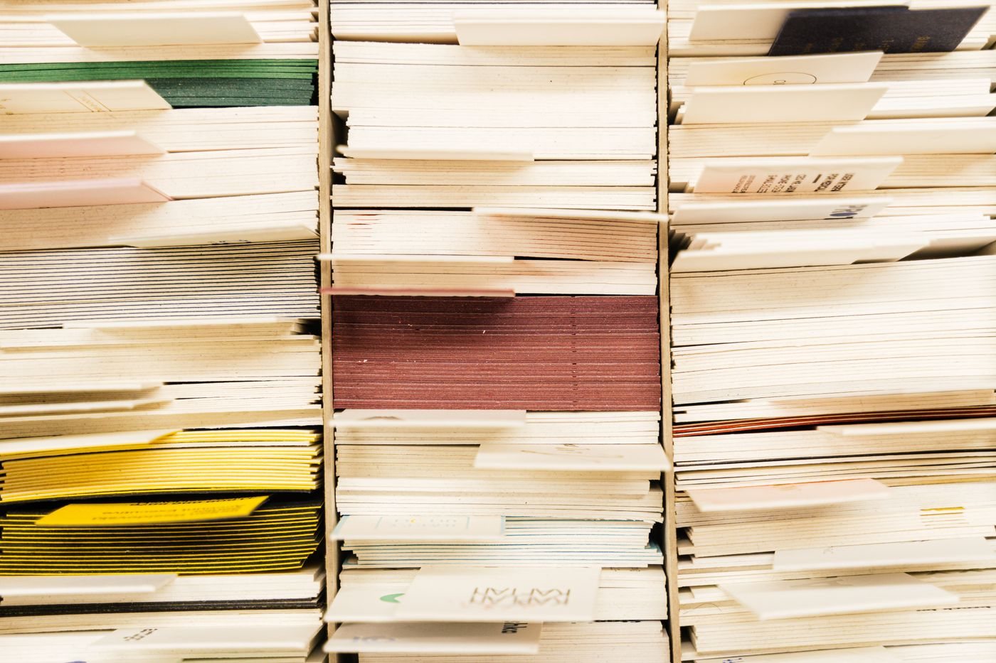 Paper documents arranged in a filing system