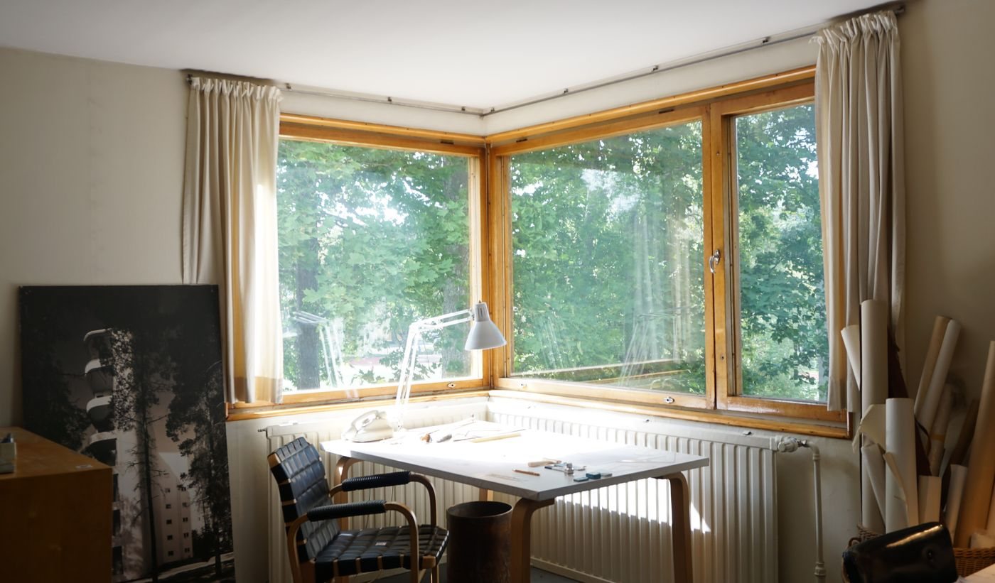 Freestanding home office desk beside a window
