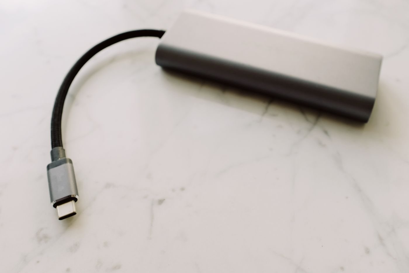 Compact USB-C adapter on a marble surface