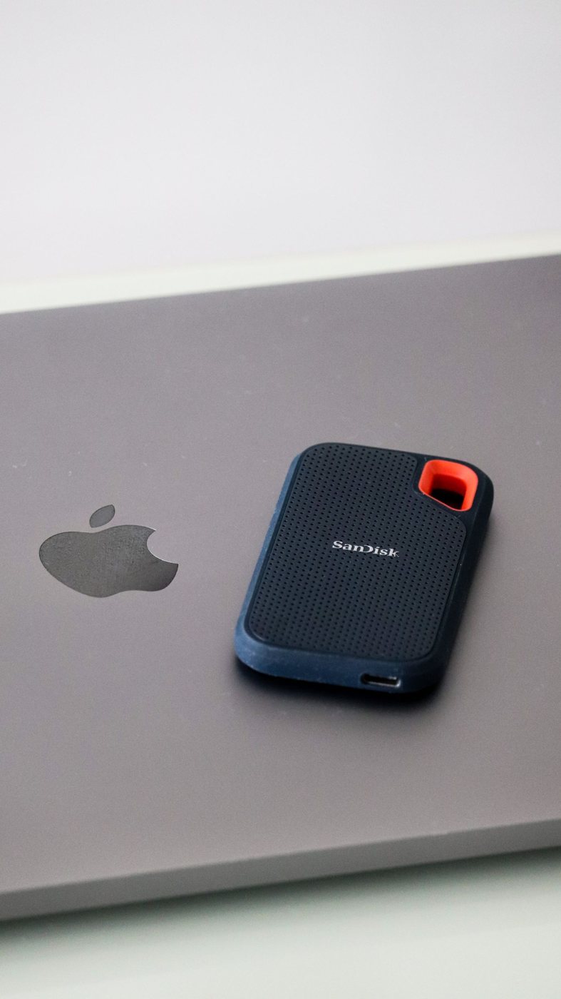 Portable SSD resting beside a laptop