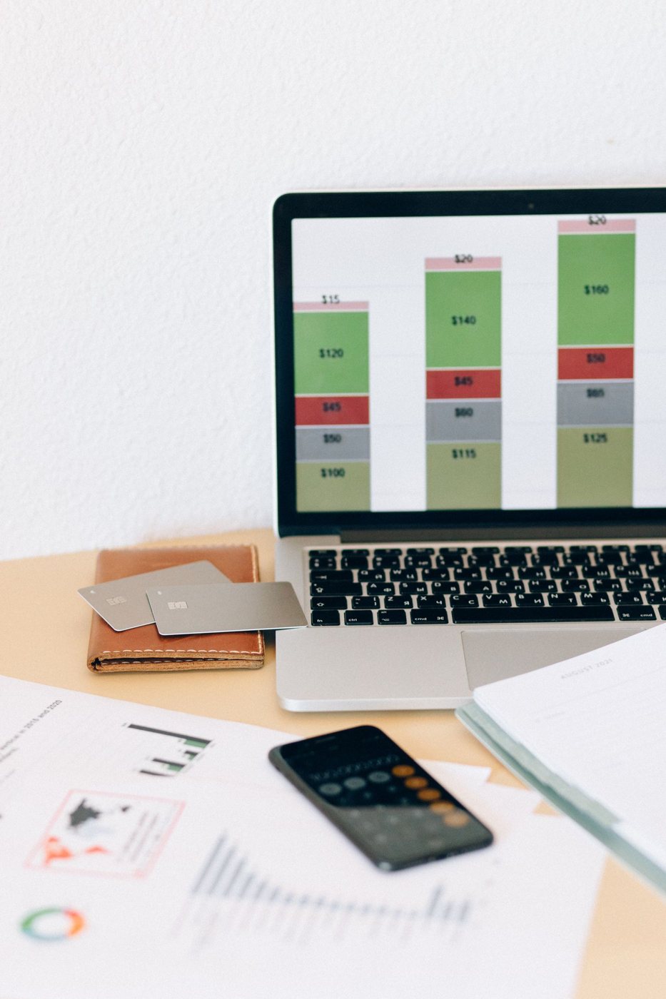 Laptop and financial documents on a desk
