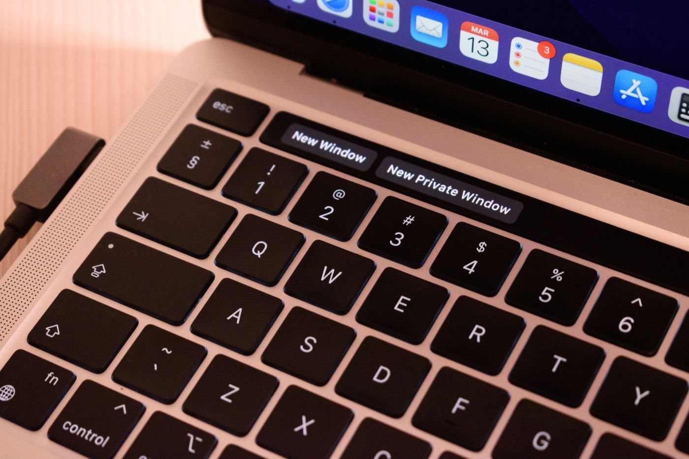 Laptop keyboard and browser controls on screen
