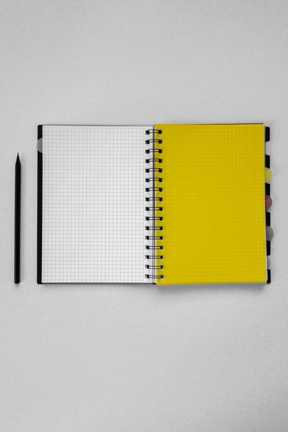 Notebooks and pencils arranged on a desk