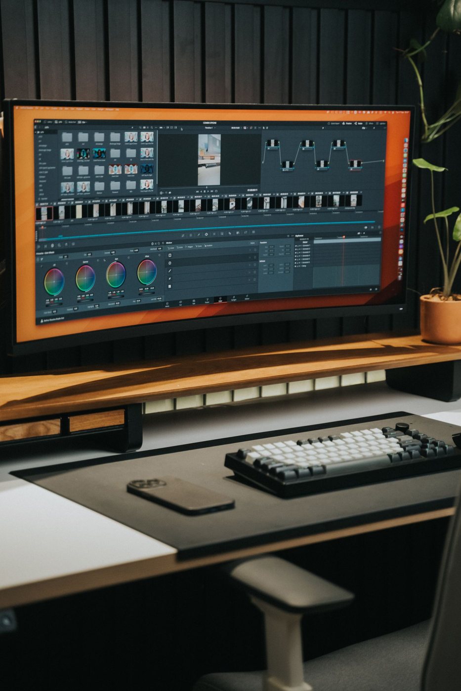 Ultrawide monitor displaying a video editing workspace
