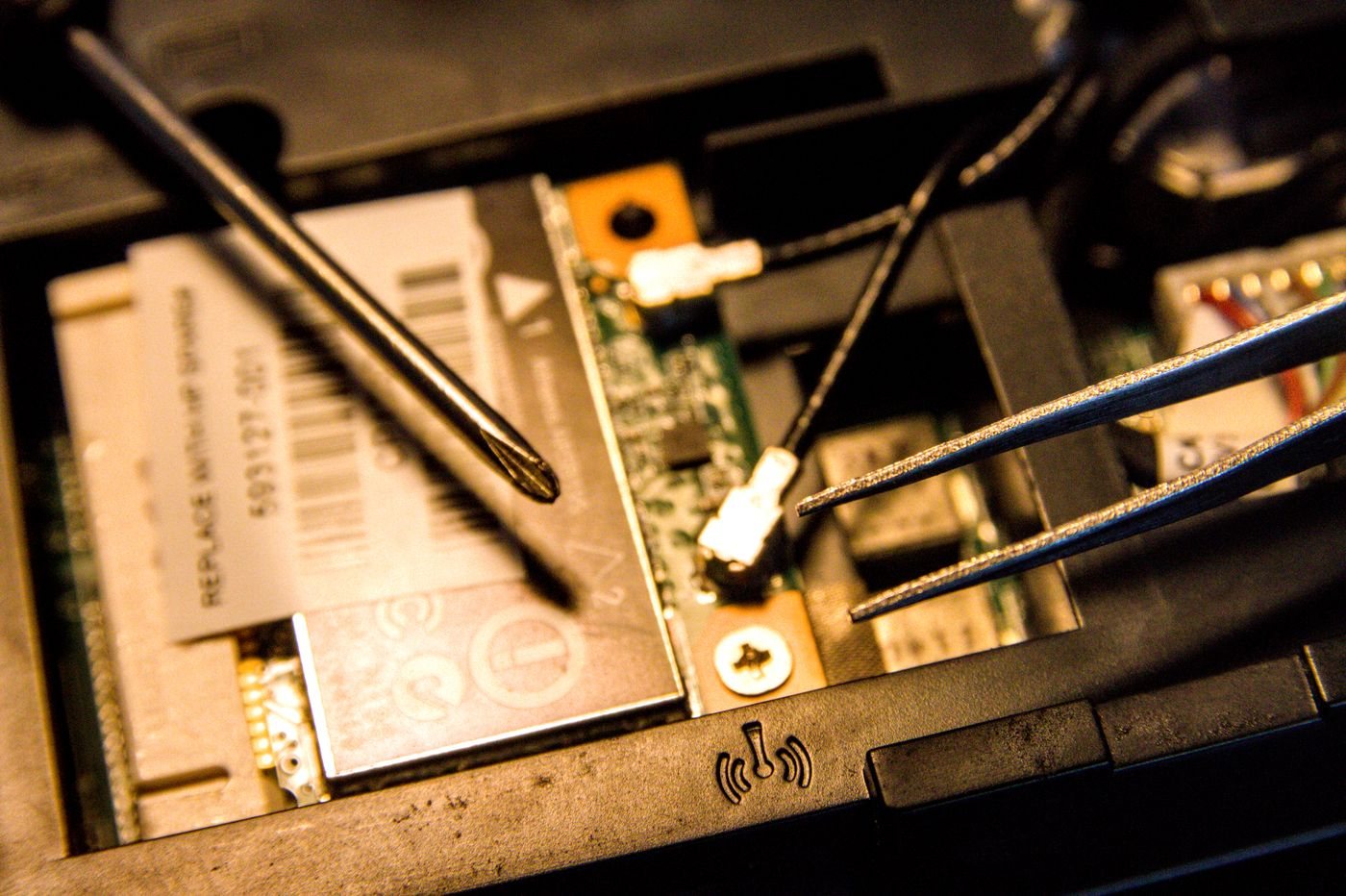 Laptop internal components exposed during repair
